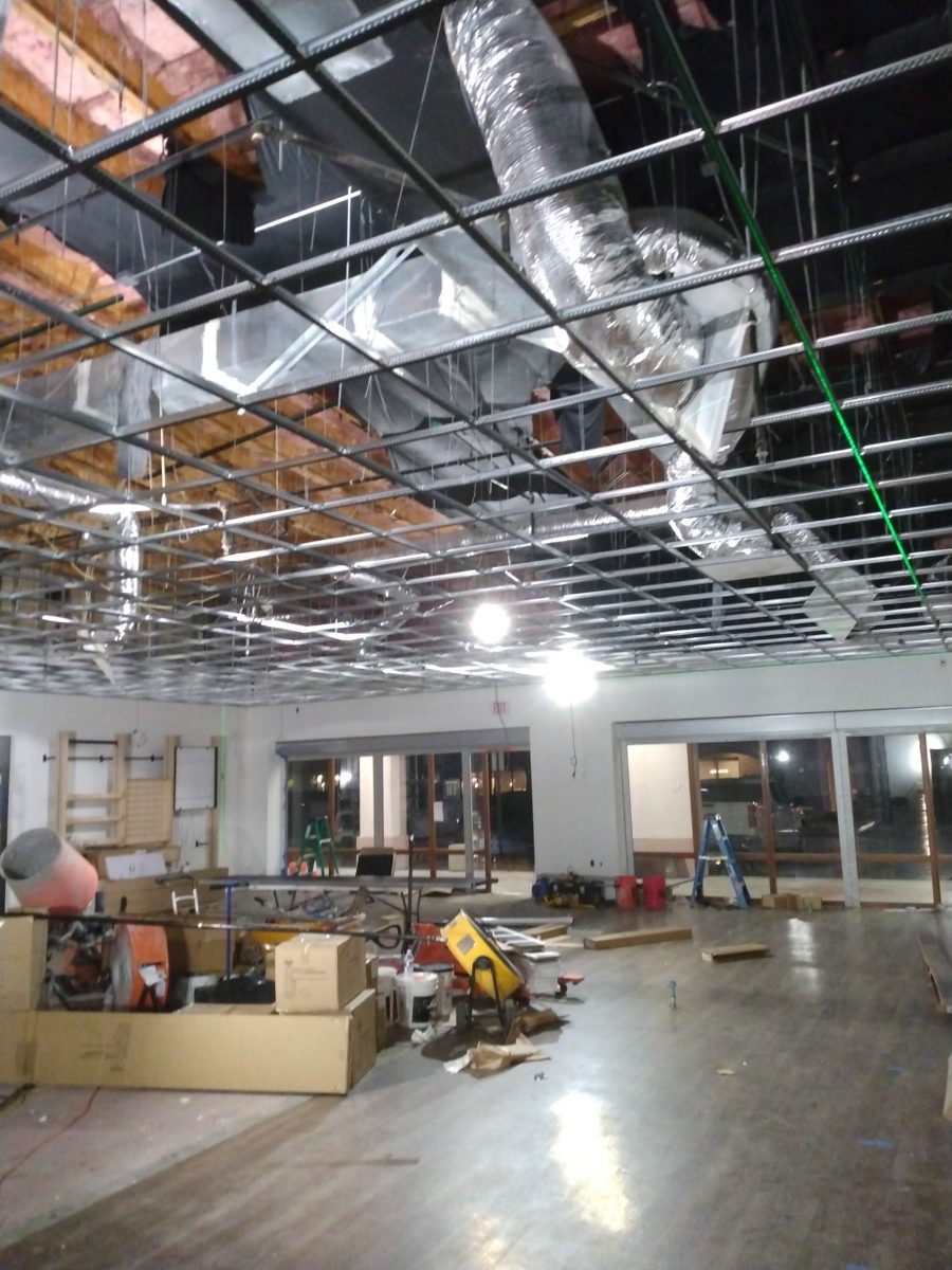 Commercial interior build-out with exposed ductwork and ceiling grid, Tucson area